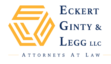 Logo for "Eckert Ginty & Legg LLC Attorneys at Law" featuring a geometric yellow design on the left and blue text on the right; a horizontal line and small text appear below.